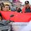 Camat Medan Belawan Bagikan Bendera Merah Putih ke Pengguna Jalan