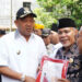Jelang HUT Kemerdekaan RI, Plt Bupati Langkat Ikut Bagikan 10 Juta Bendera Merah Putih