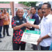 Bupati dan Wakil Menyerahkan Bukti Kepesertaan BPJS PBI APBD Asahan