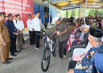Jokowi Salurkan Bantuan Pangan di Padanglawas, Hassanudin Pastikan Pemprov Komitmen Jaga Stabilitas dan Ketahanan Pangan di Sumut
