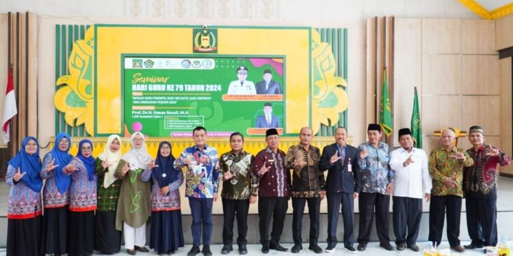 Pj. Bupati Langkat Dorong Guru Jadi Pemimpin Inspiratif di Seminar Hari Guru ke-79