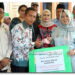 Plt. Bupati Langkat Tiorita Serahkan Kunci Rumah Layak Huni untuk Warga Pematang Serai